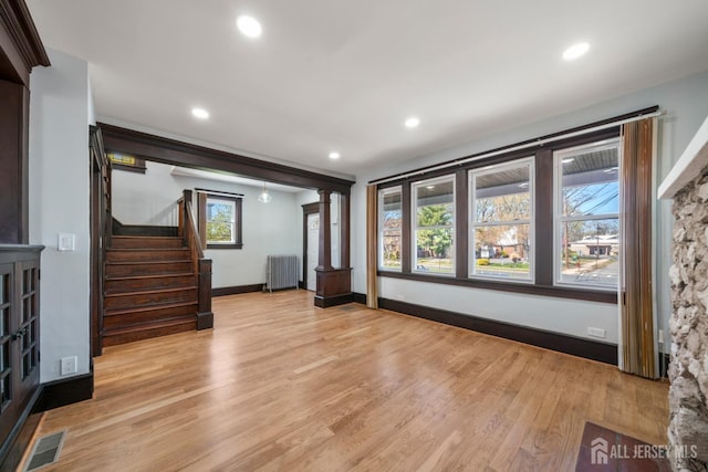657 Amboy Ave, Edison, NJ 08837 - unfurnished living room with radiator heating unit, light wood-style flooring, recessed lighting, stairs, and baseboards