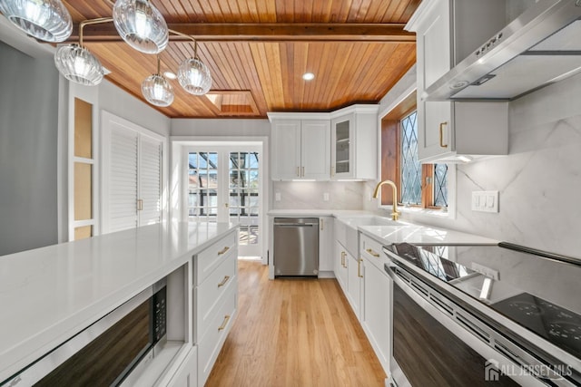 657 Amboy Ave, Edison, NJ 08837 - kitchen with wood ceiling, exhaust hood, stainless steel appliances, a sink, and light wood finished floors
