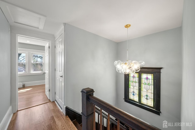 657 Amboy Ave, Edison, NJ 08837 - hall with an upstairs landing, wood finished floors, baseboards, and a chandelier
