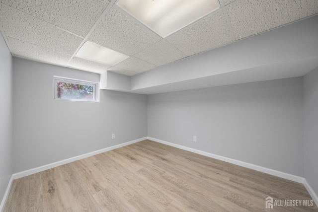 657 Amboy Ave, Edison, NJ 08837 - basement featuring a drop ceiling, baseboards, and wood finished floors