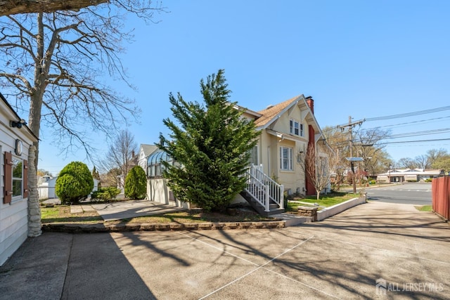 657 Amboy Ave, Edison, NJ 08837 - view of property exterior featuring a chimney