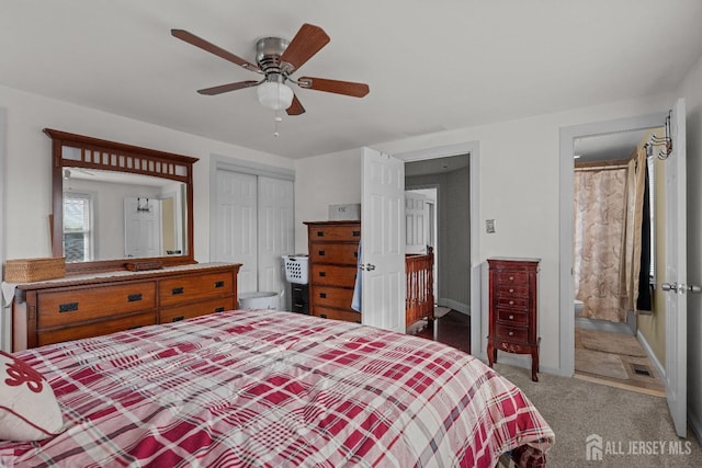 carpeted bedroom with a ceiling fan, a closet, and connected bathroom