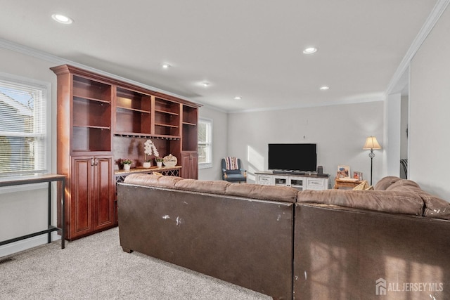 living area with recessed lighting, light colored carpet, and crown molding