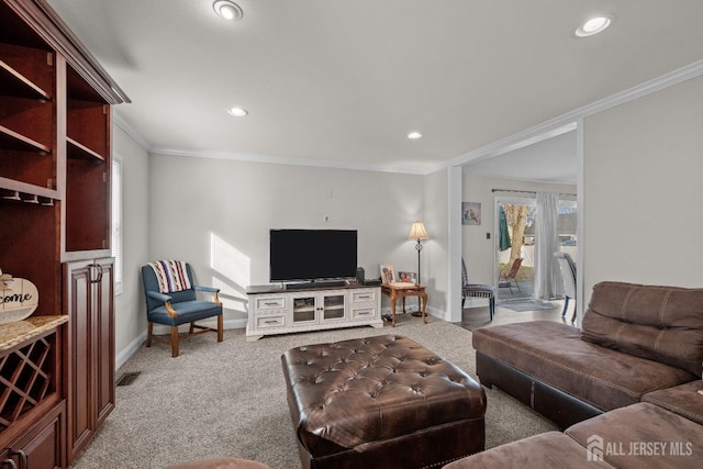 living area with carpet floors, crown molding, and baseboards