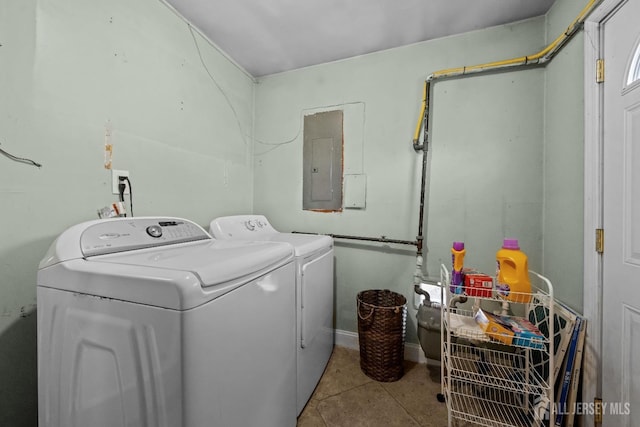 laundry room featuring laundry area, tile patterned flooring, electric panel, and washing machine and clothes dryer