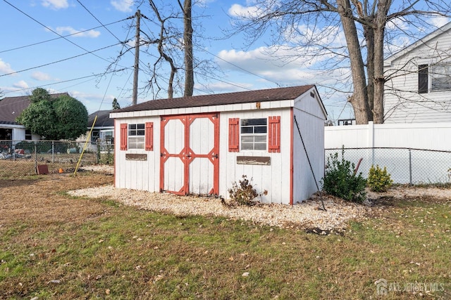 view of shed featuring a fenced backyard