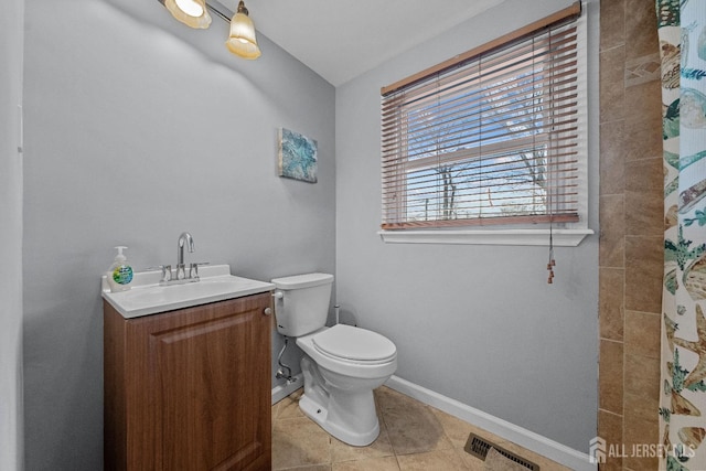 full bathroom featuring visible vents, toilet, vanity, baseboards, and tile patterned floors