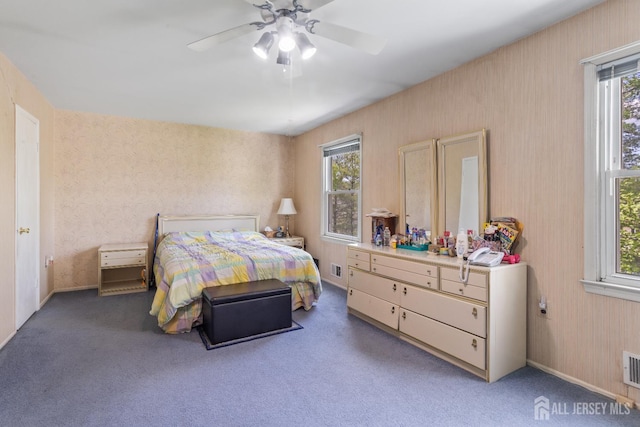 32 Astor Ct, Sayreville, NJ 08872 - carpeted bedroom with multiple windows, ceiling fan, baseboards, and wallpapered walls