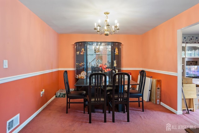 32 Astor Ct, Sayreville, NJ 08872 - carpeted dining room with a chandelier and baseboards