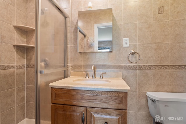 32 Astor Ct, Sayreville, NJ 08872 - full bathroom featuring vanity, tile walls, a stall shower, and toilet