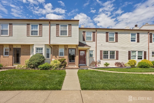 32 Astor Ct, Sayreville, NJ 08872 - view of property with a front yard and brick siding