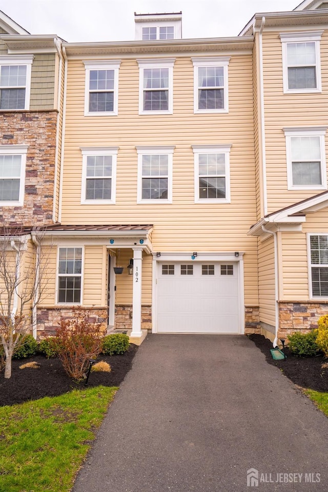 102 Matutina Rd, Monroe, NJ 08831 - view of property with stone siding, an attached garage, and driveway