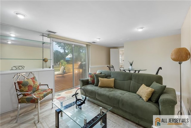 living room with light hardwood / wood-style floors