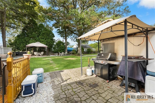 view of patio / terrace with a gazebo and grilling area