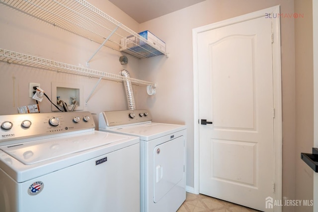 laundry room featuring washing machine and dryer