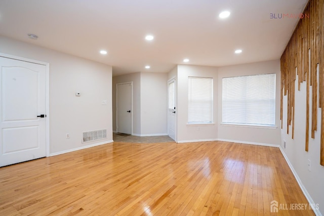 spare room with light wood-type flooring