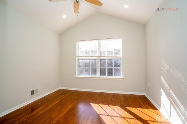 spare room featuring ceiling fan, lofted ceiling, and hardwood / wood-style flooring