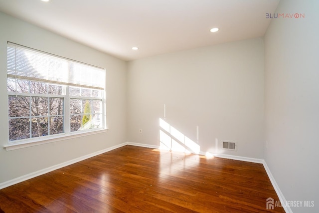 empty room featuring hardwood / wood-style floors