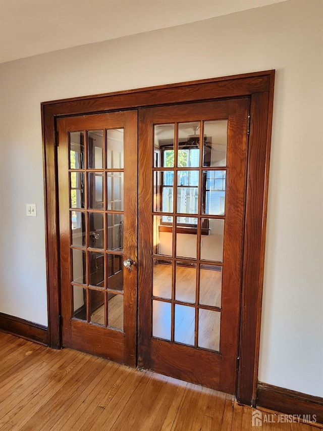 room details featuring hardwood / wood-style floors and french doors