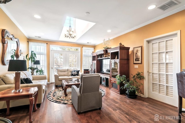 living room with visible vents, dark wood finished floors, a chandelier, ornamental molding, and recessed lighting