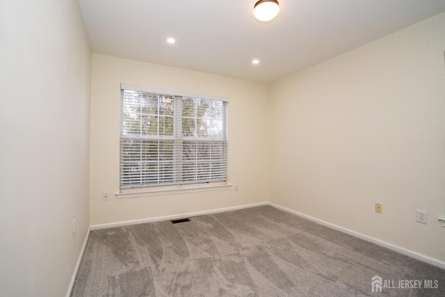 empty room with carpet flooring