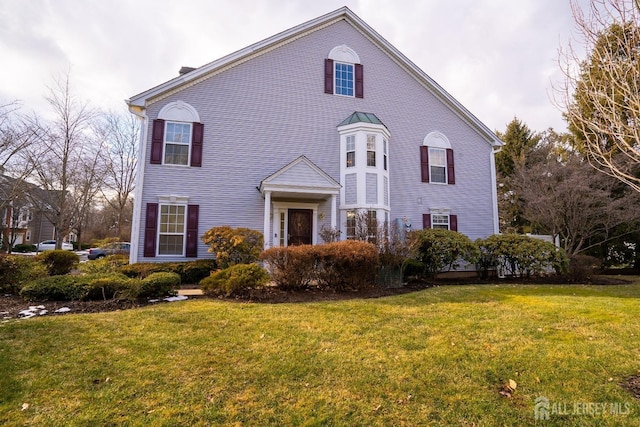 view of front property with a front lawn