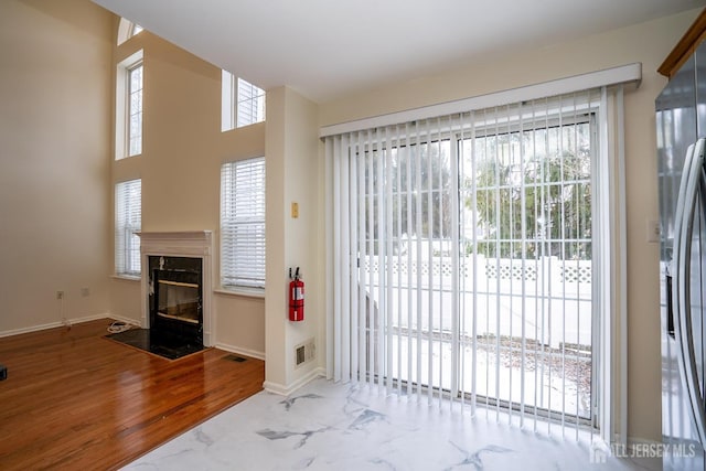 entryway with a fireplace