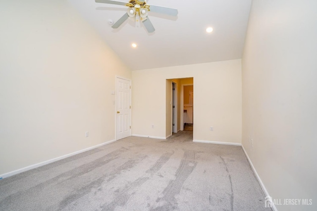 unfurnished room featuring high vaulted ceiling, light carpet, and ceiling fan