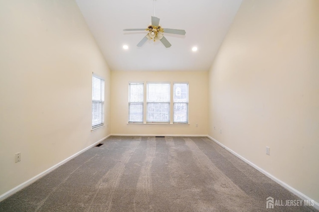 spare room featuring high vaulted ceiling, ceiling fan, and carpet flooring