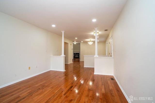 empty room with hardwood / wood-style flooring