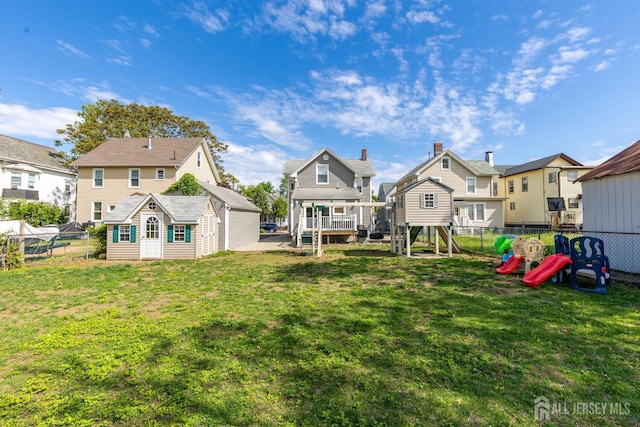 94 2nd St, Keyport, NJ 07735 - back of property featuring a playground, a residential view, and an outbuilding