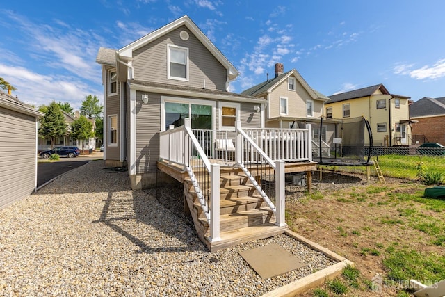 94 2nd St, Keyport, NJ 07735 - back of house featuring fence, a wooden deck, and a residential view