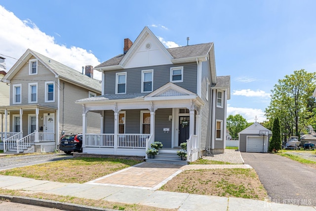 94 2nd St, Keyport, NJ 07735 - view of front of property with a porch, a detached garage, an outdoor structure, driveway, and a chimney