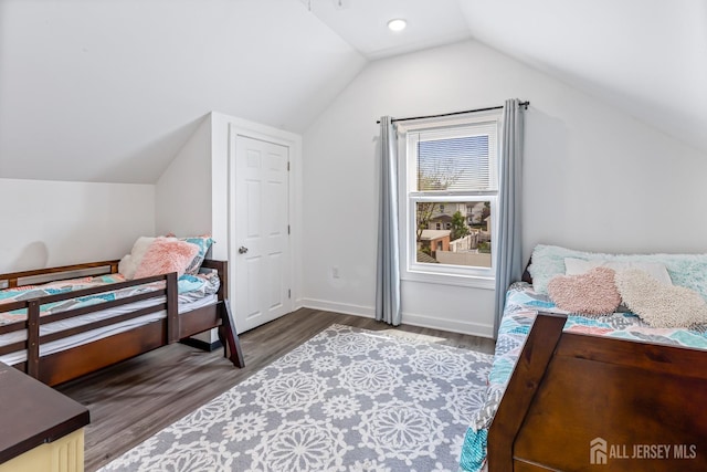 94 2nd St, Keyport, NJ 07735 - bedroom featuring wood finished floors, vaulted ceiling, and baseboards