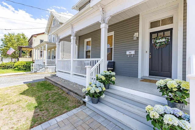 94 2nd St, Keyport, NJ 07735 - doorway to property featuring covered porch