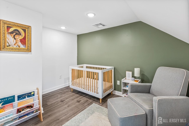 94 2nd St, Keyport, NJ 07735 - bedroom with wood finished floors, lofted ceiling, a crib, recessed lighting, and baseboards