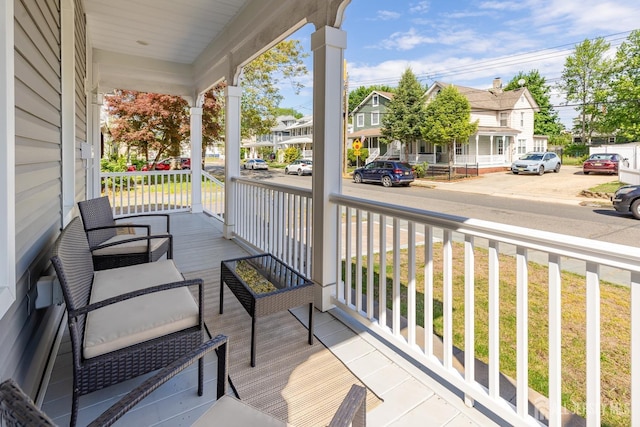 94 2nd St, Keyport, NJ 07735 - wooden deck with a porch and a residential view