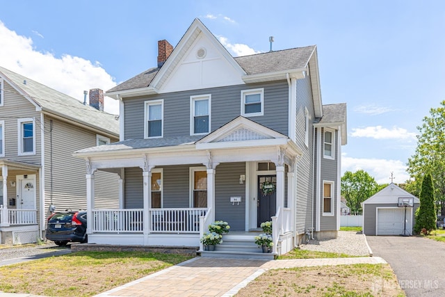 94 2nd St, Keyport, NJ 07735 - view of front of home featuring a porch, an outdoor structure, a garage, a chimney, and driveway