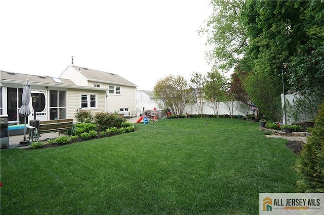 view of yard with a sunroom