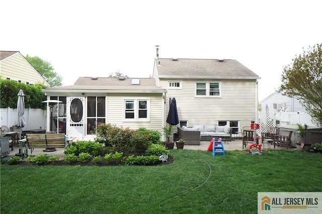 back of property featuring an outdoor hangout area, a patio, and a sunroom