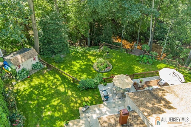 view of yard with a patio area and a shed