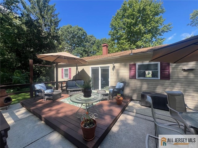 wooden deck featuring outdoor lounge area