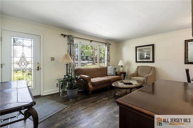 living room featuring ornamental molding and dark hardwood / wood-style floors