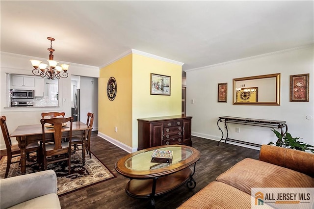 living room featuring a notable chandelier, ornamental molding, and dark hardwood / wood-style floors