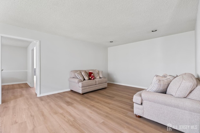 334 Waterside Blvd, Monroe, NJ 08831 - living area with light wood finished floors and a textured ceiling