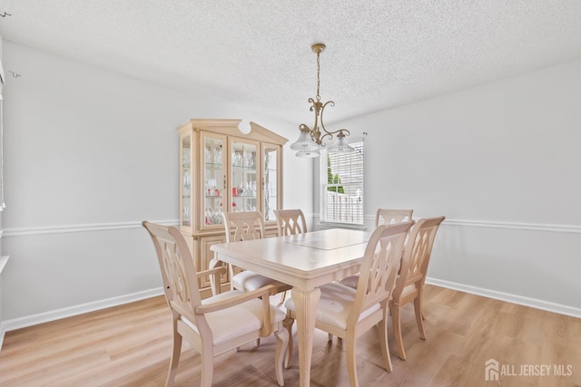 334 Waterside Blvd, Monroe, NJ 08831 - dining space featuring a textured ceiling, a chandelier, and light wood-type flooring