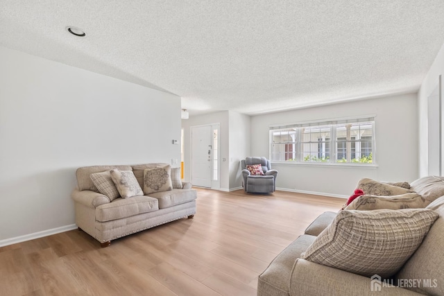 334 Waterside Blvd, Monroe, NJ 08831 - living area with light wood-style flooring and a textured ceiling