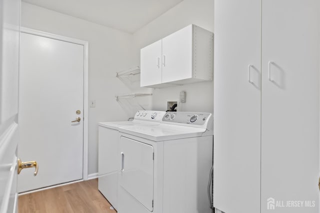 334 Waterside Blvd, Monroe, NJ 08831 - laundry area featuring independent washer and dryer, cabinet space, and light wood finished floors