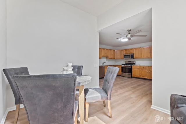 334 Waterside Blvd, Monroe, NJ 08831 - dining area with light wood-style flooring and a ceiling fan