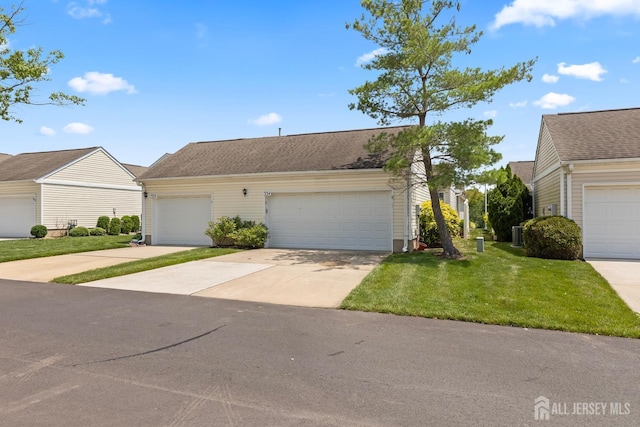 334 Waterside Blvd, Monroe, NJ 08831 - view of front facade with a front yard, a garage, and driveway